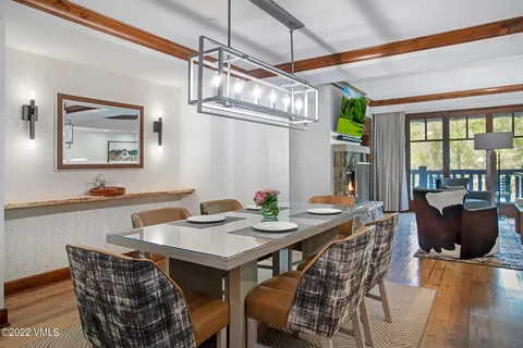 a view of a dining room with furniture window and outside view
