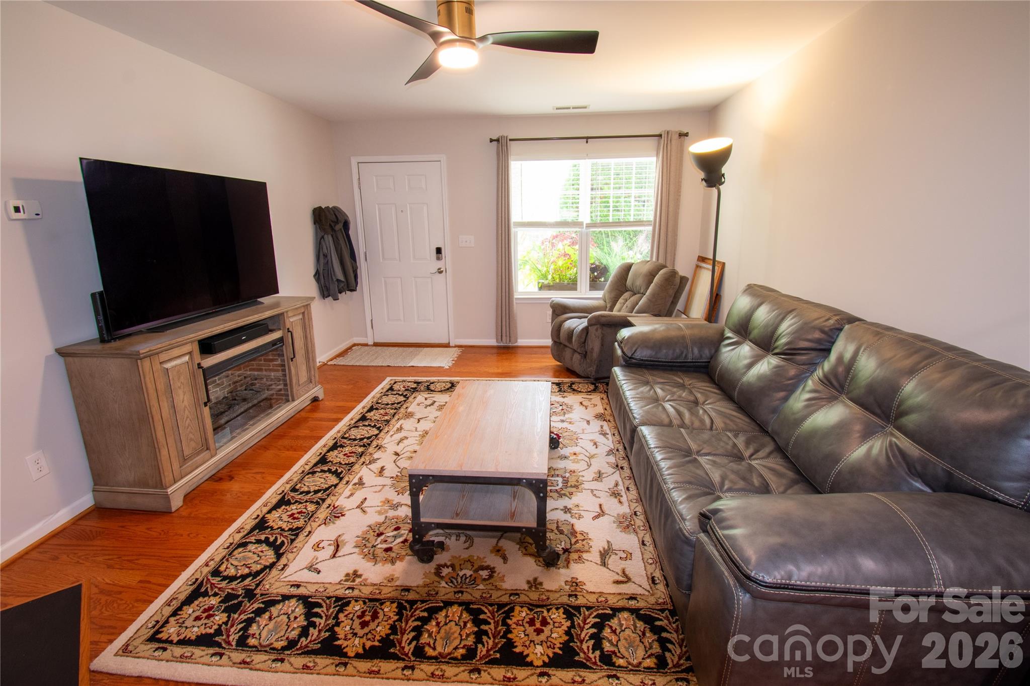 19 Singleton Lane Fletcher, NC 28732 - Photo 4 of 19 a living room with furniture and a flat screen tv