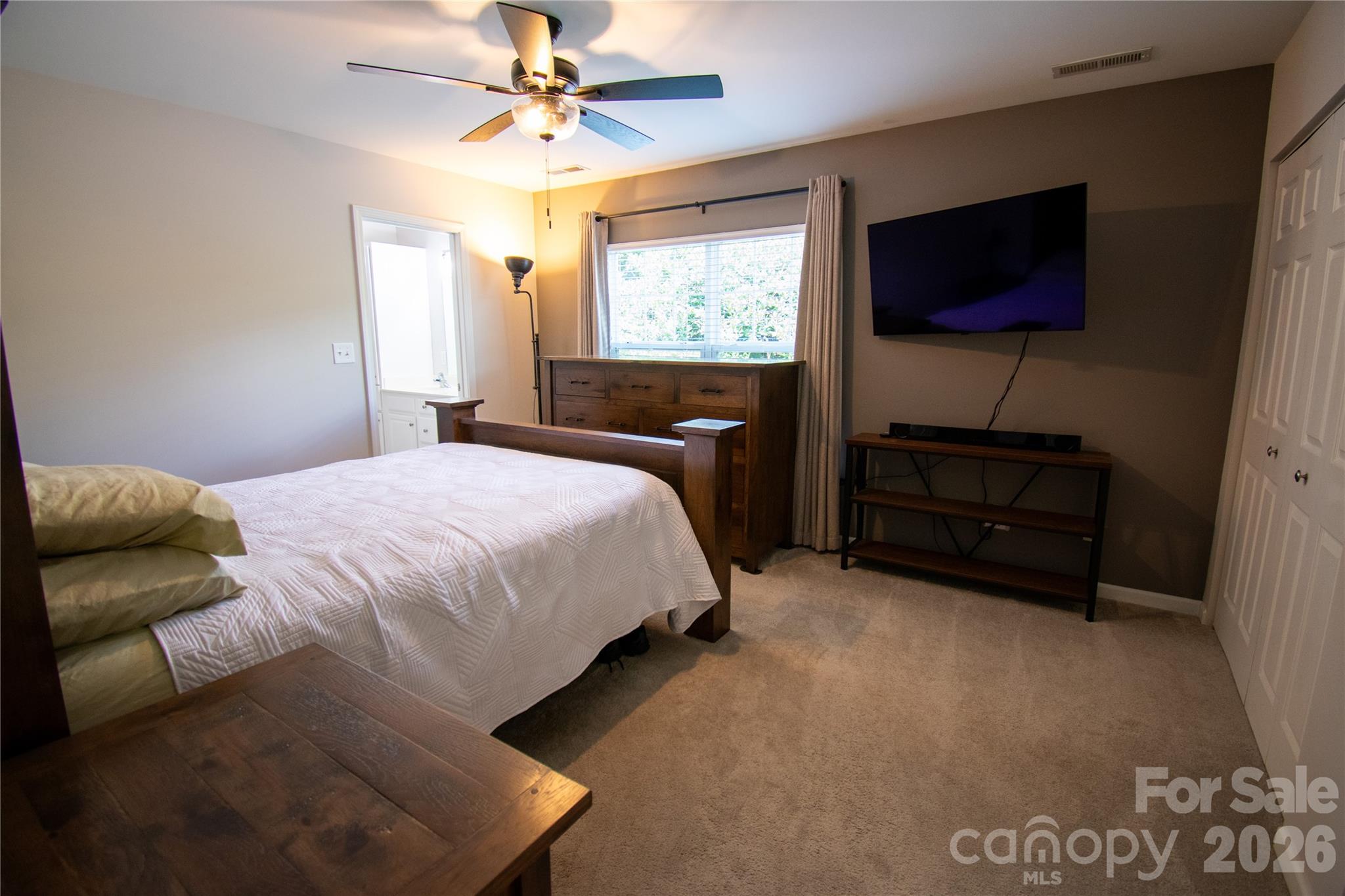 19 Singleton Lane Fletcher, NC 28732 - Photo 10 of 19 a bedroom with a bed and a flat screen tv