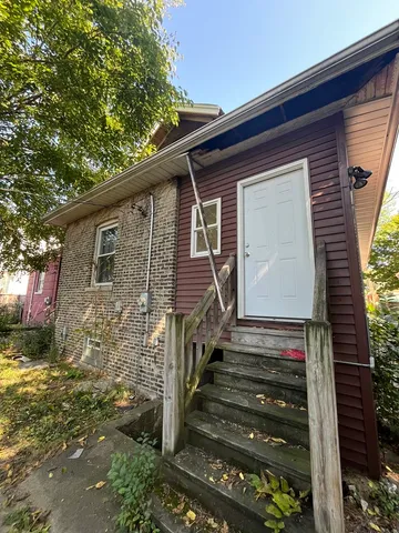 a front view of house with stairs