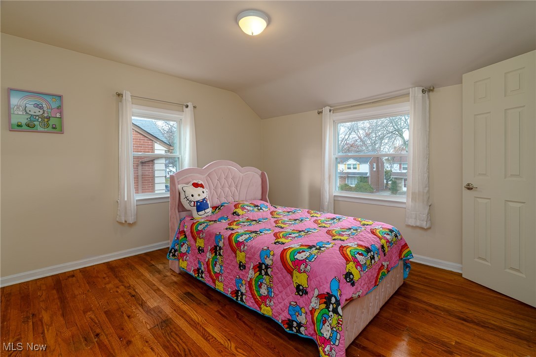 3790 Sherwood Road Cleveland, OH 44121 - Photo 7 of 13 Bedroom featuring vaulted ceiling and hardwood / wood-style flooring