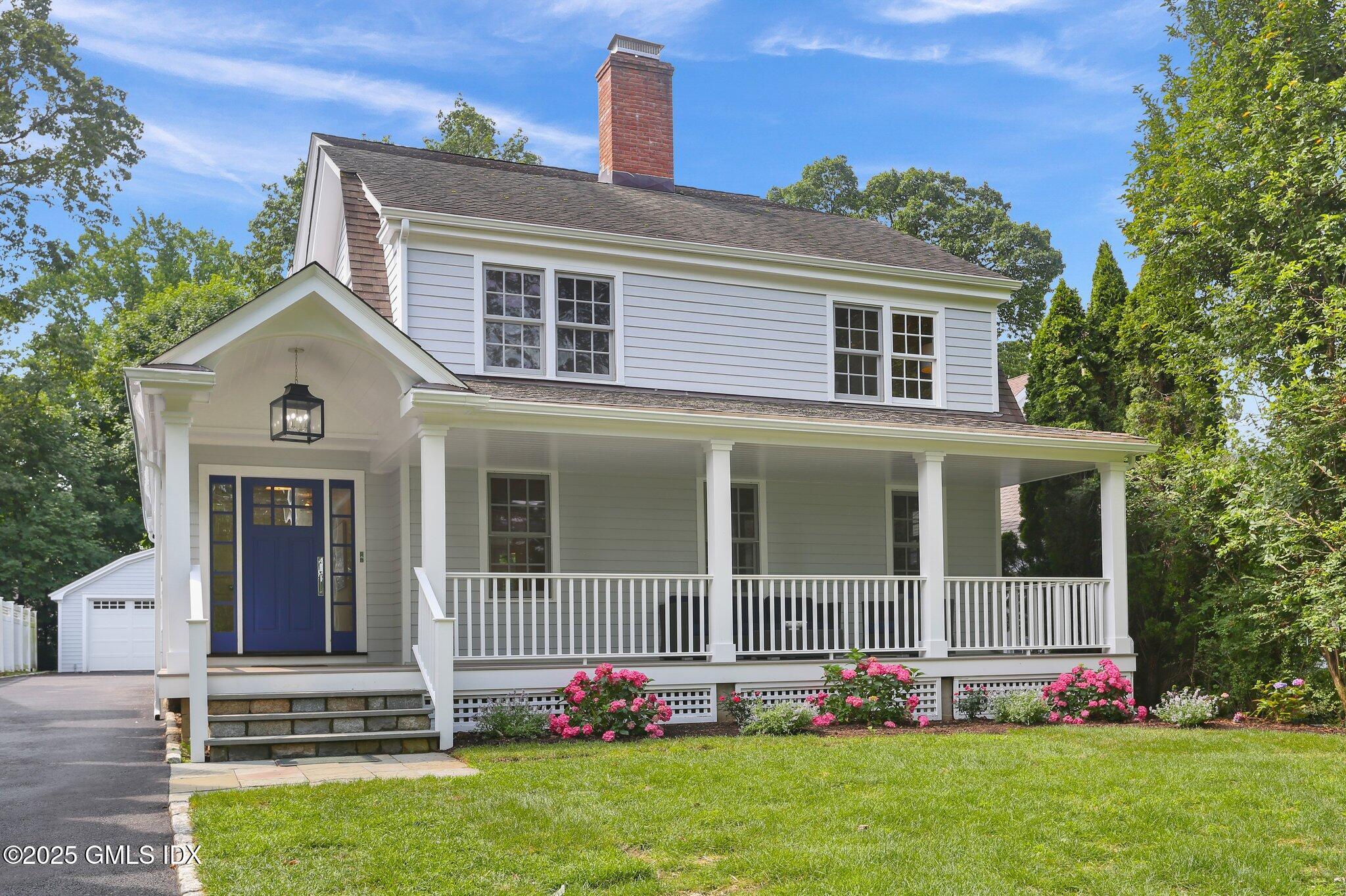 36 Hendrie Avenue Riverside, CT 06878 - Photo 1 of 33 front view of a house with a yard