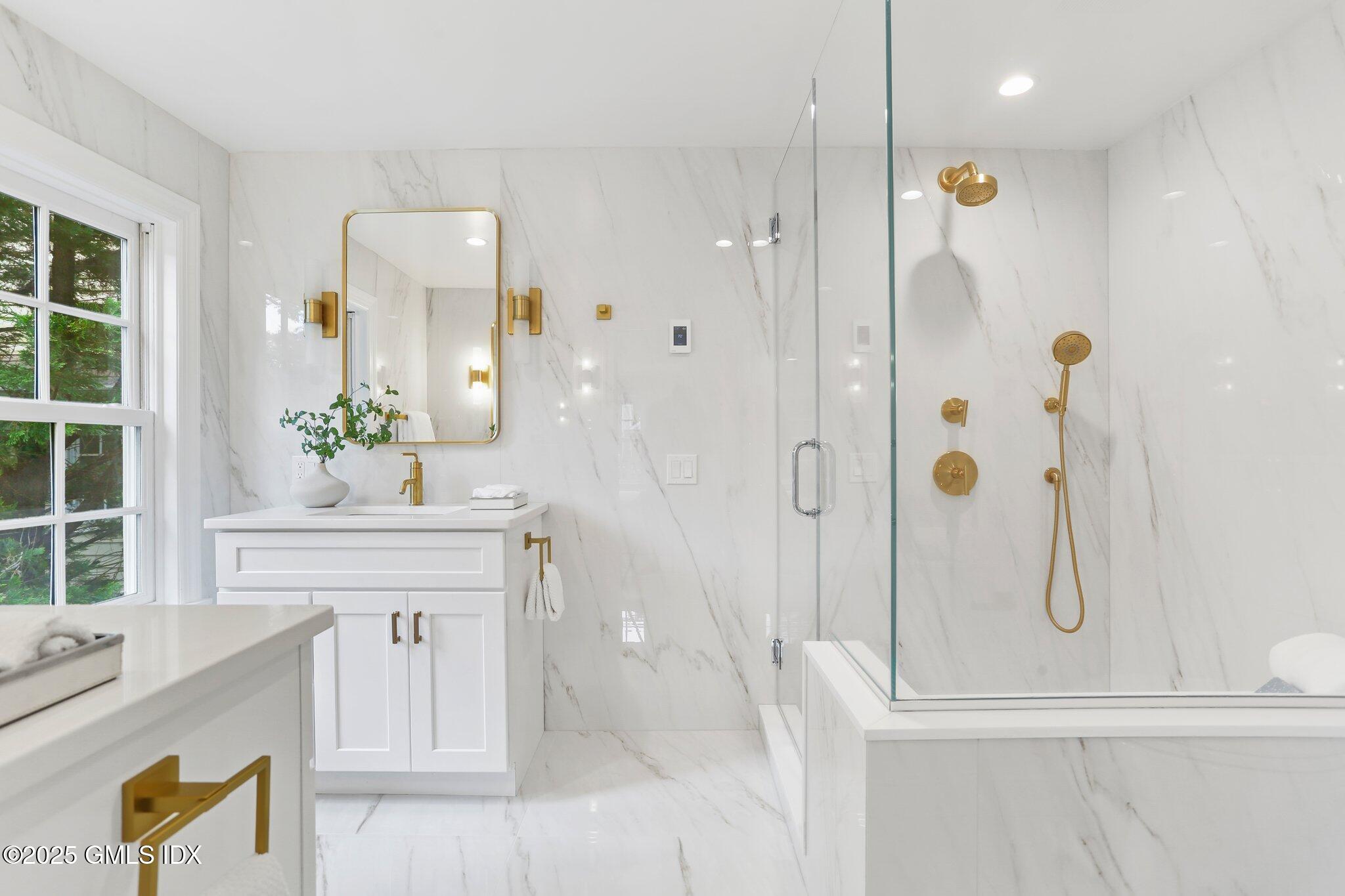 36 Hendrie Avenue Riverside, CT 06878 - Photo 14 of 33 a bathroom with a tub sink and mirror