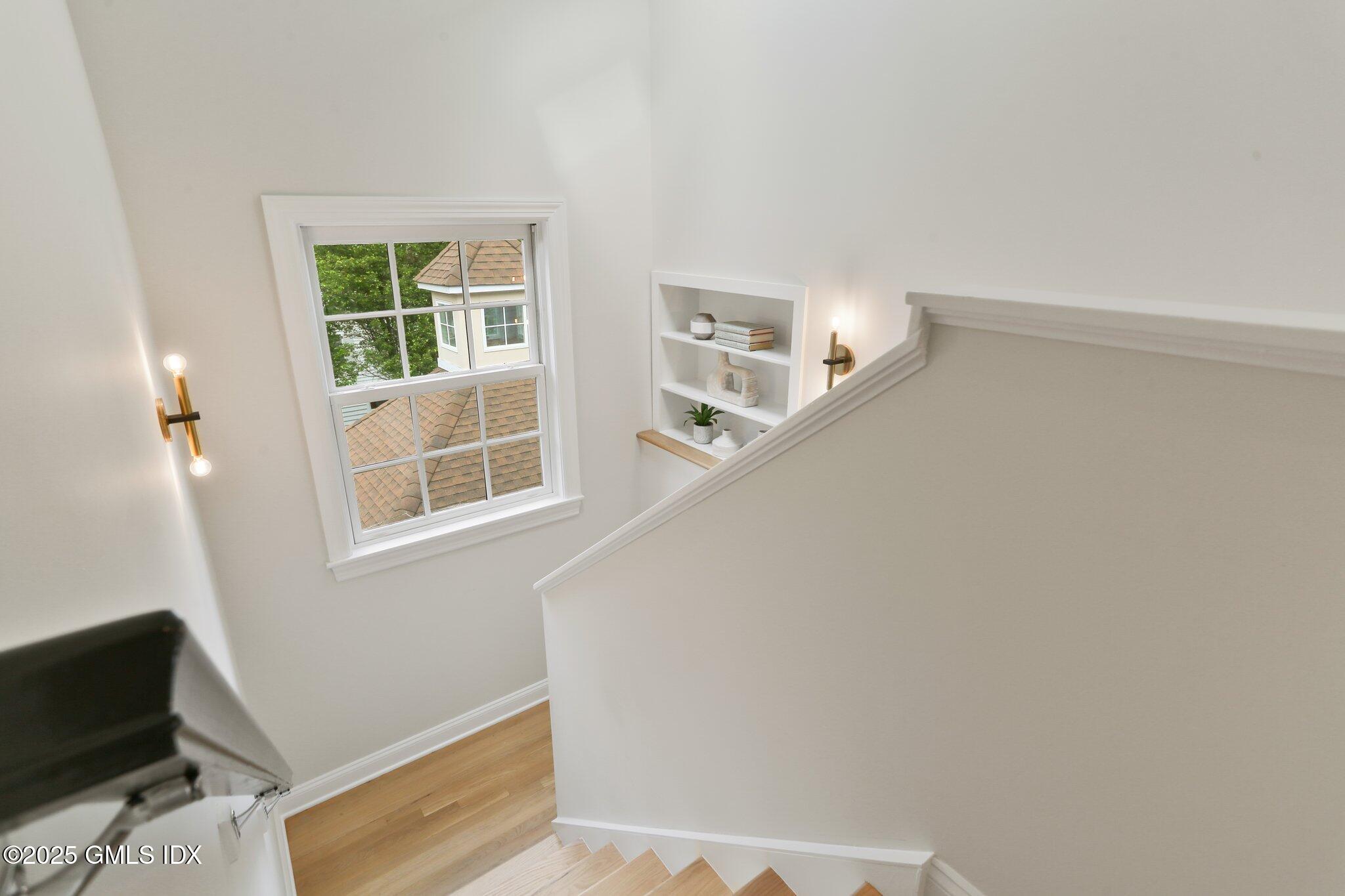 36 Hendrie Avenue Riverside, CT 06878 - Photo 21 of 33 a view of entryway with stairs and wooden floor