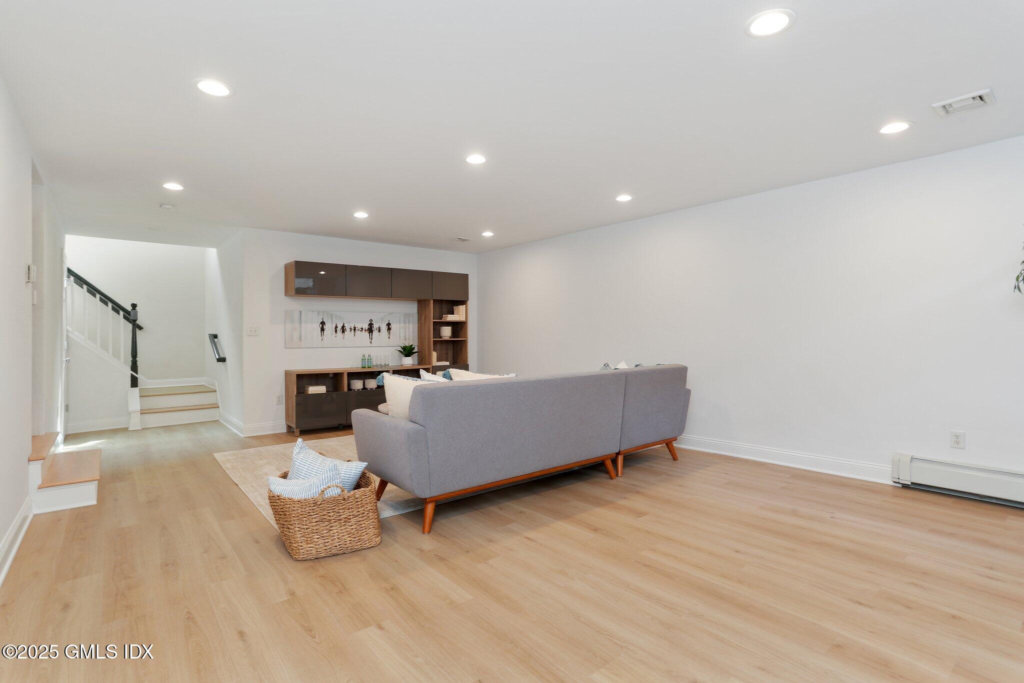 36 Hendrie Avenue Riverside, CT 06878 - Photo 25 of 33 a living room with furniture and a wooden floor