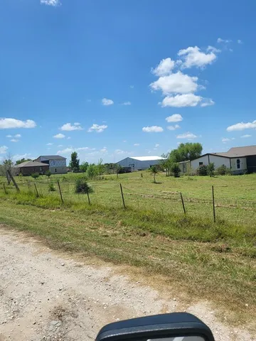 a view of a house with a big yard