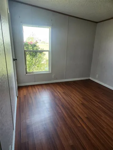 a kitchen with kitchen island granite countertop a stove a sink and a refrigerator