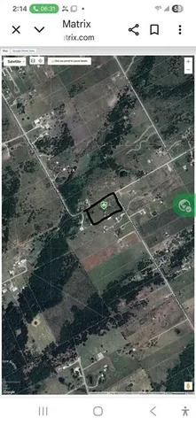 a backyard of a house with lots of green space and fountain