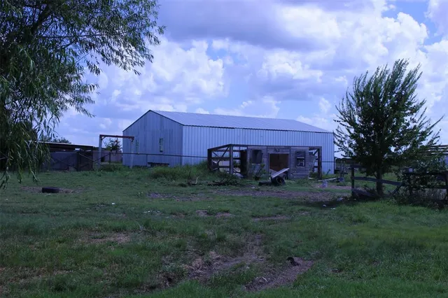 a view of a backyard of a house
