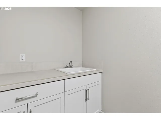 a bathroom with a sink and vanity