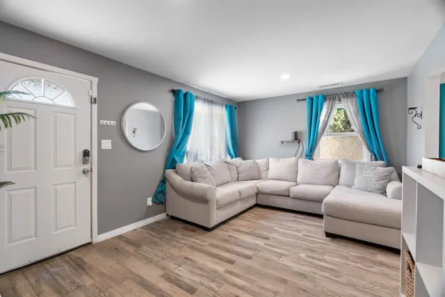 a living room with furniture and a window