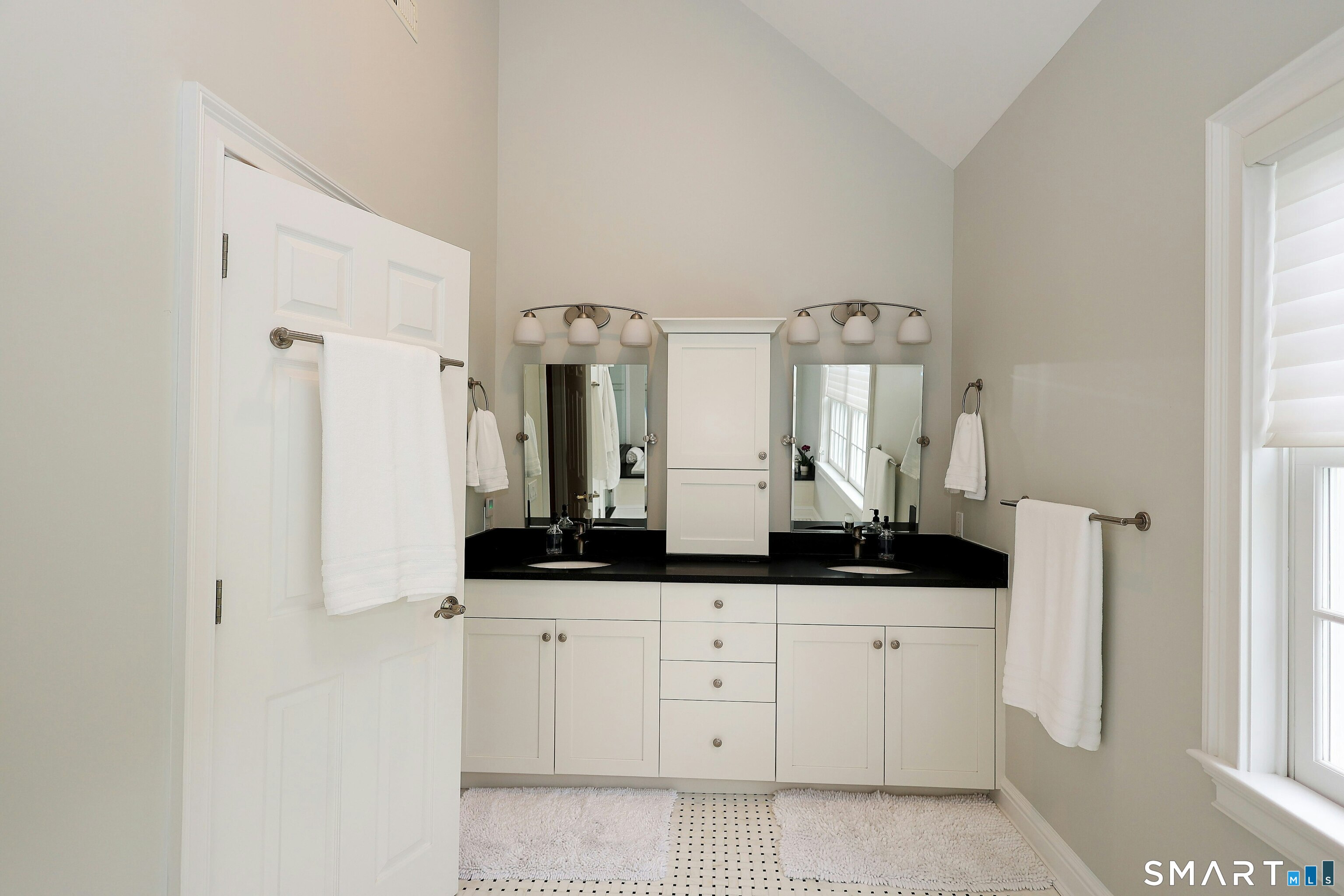 30 Whipstick Road Ridgefield, CT 06877 - Photo 28 of 40 a bathroom with a granite countertop sink and a mirror