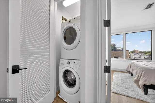 a view of living room with washer and dryer