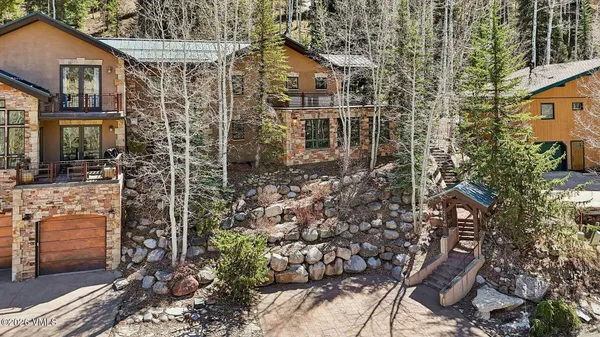 a bathroom with a shower and a sink