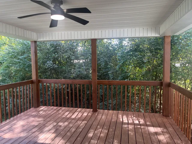 a balcony with wooden floor outdoor space and balcony
