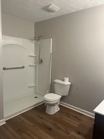 a bathroom with a toilet and a sink
