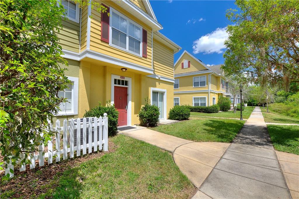 4562 Yellowgold Road East, Unit 102 Kissimmee, FL 34746 - Photo 1 of 1 front view of a house with a yard