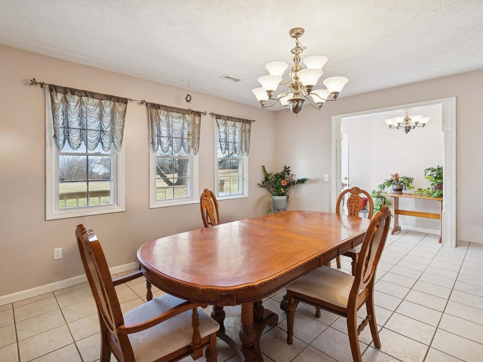 394 Pruett Road Dickson, TN 37055 - Photo 14 of 56 a dining room with furniture a chandelier and window