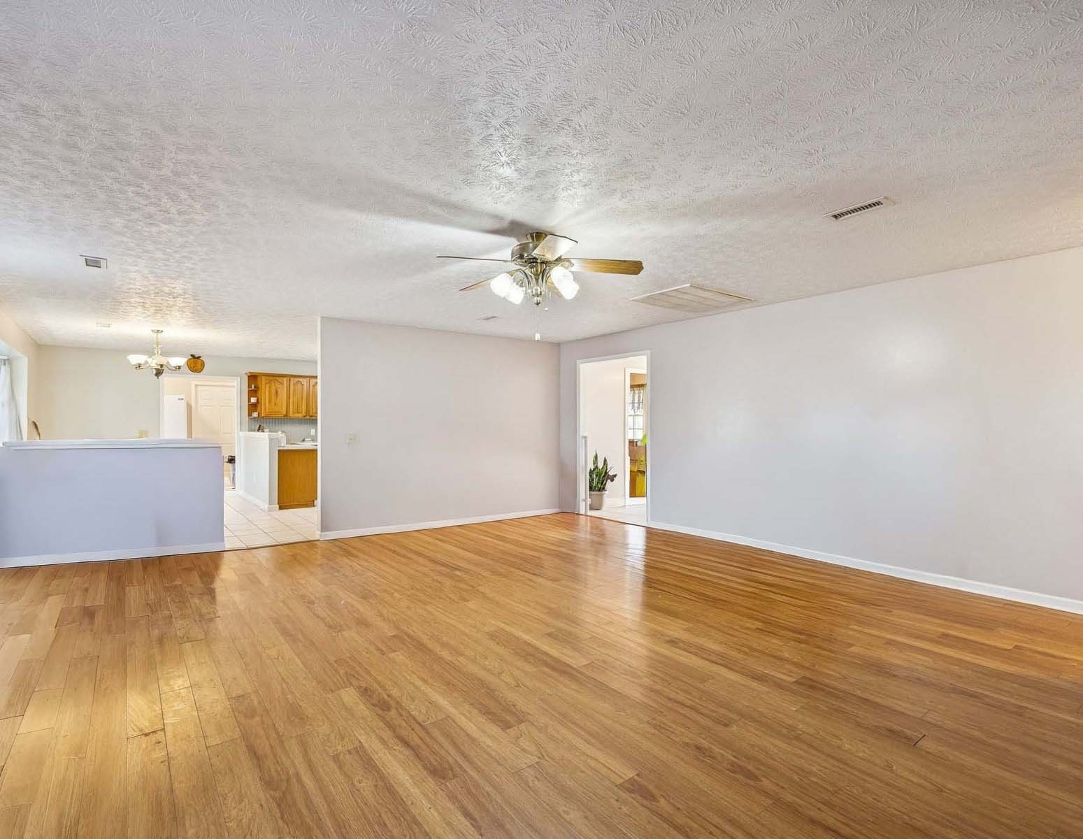 394 Pruett Road Dickson, TN 37055 - Photo 16 of 56 a view of a livingroom with a window and wooden floor