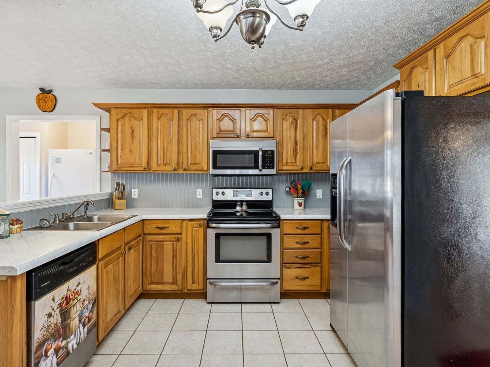 394 Pruett Road Dickson, TN 37055 - Photo 19 of 56 a kitchen with stainless steel appliances granite countertop a sink stove and refrigerator