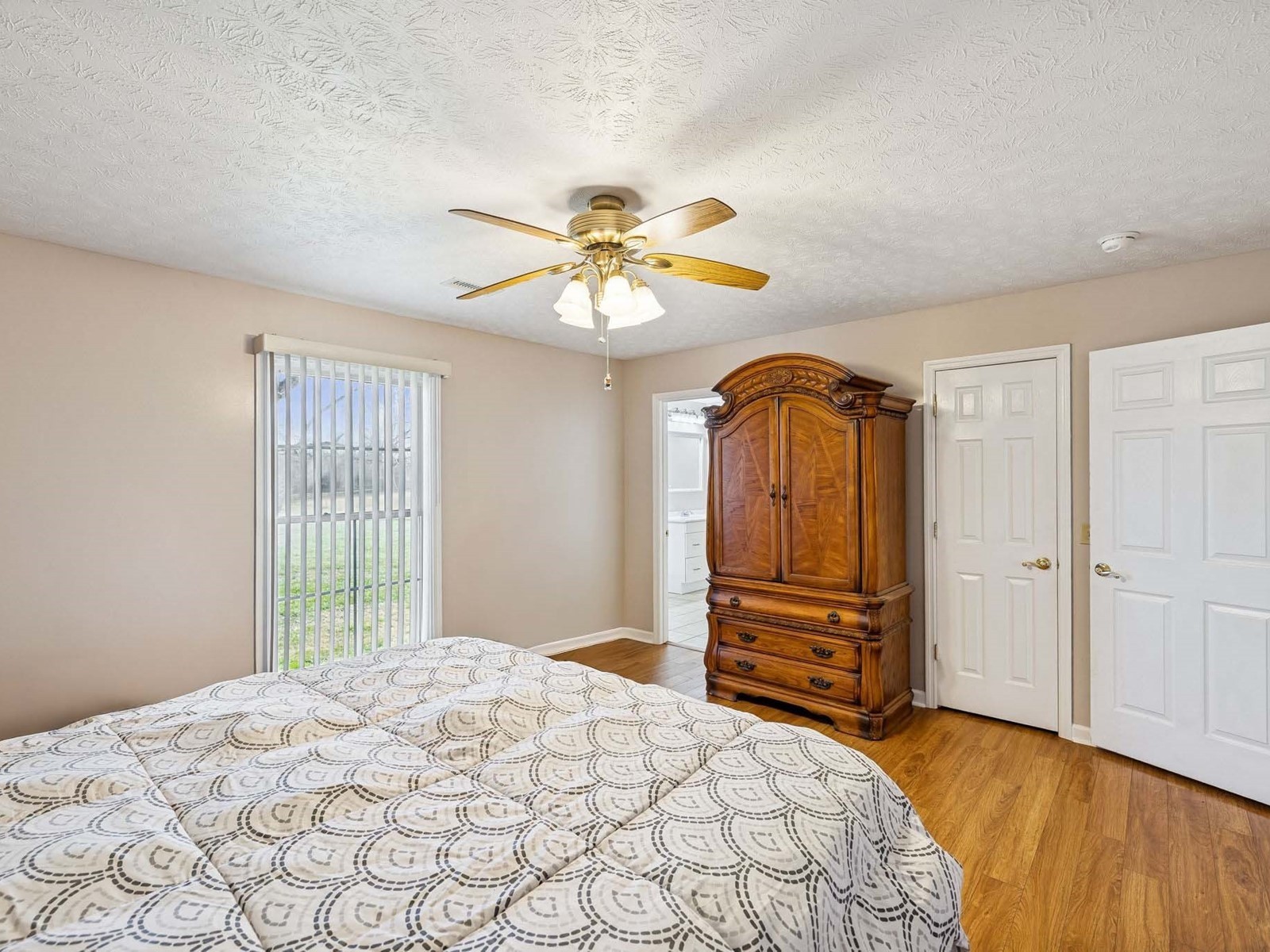 394 Pruett Road Dickson, TN 37055 - Photo 24 of 56 a bedroom with a bed and a chandelier
