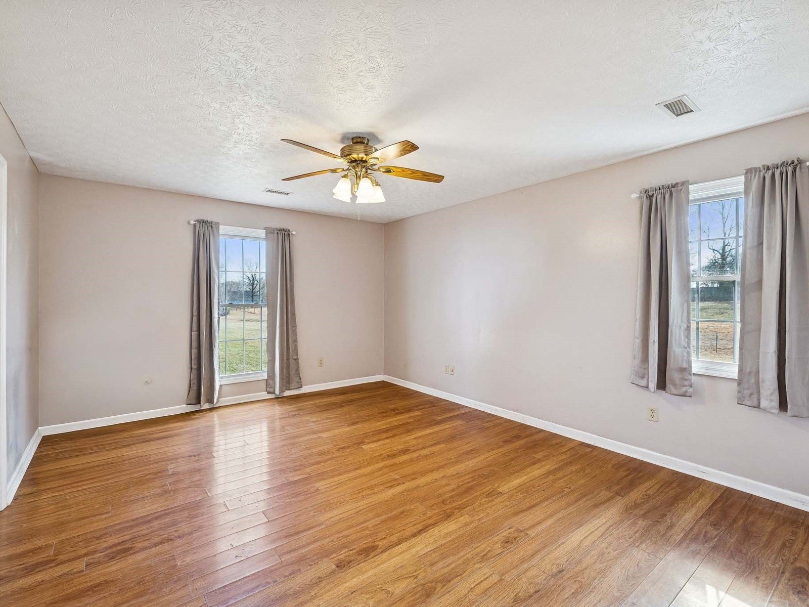 394 Pruett Road Dickson, TN 37055 - Photo 27 of 56 a view of an empty room with a window and wooden floor