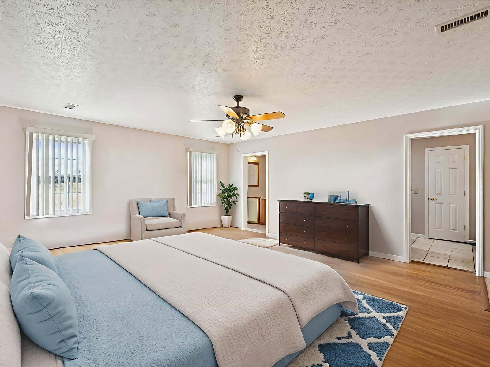 394 Pruett Road Dickson, TN 37055 - Photo 28 of 56 a bedroom with a bed and wooden floor