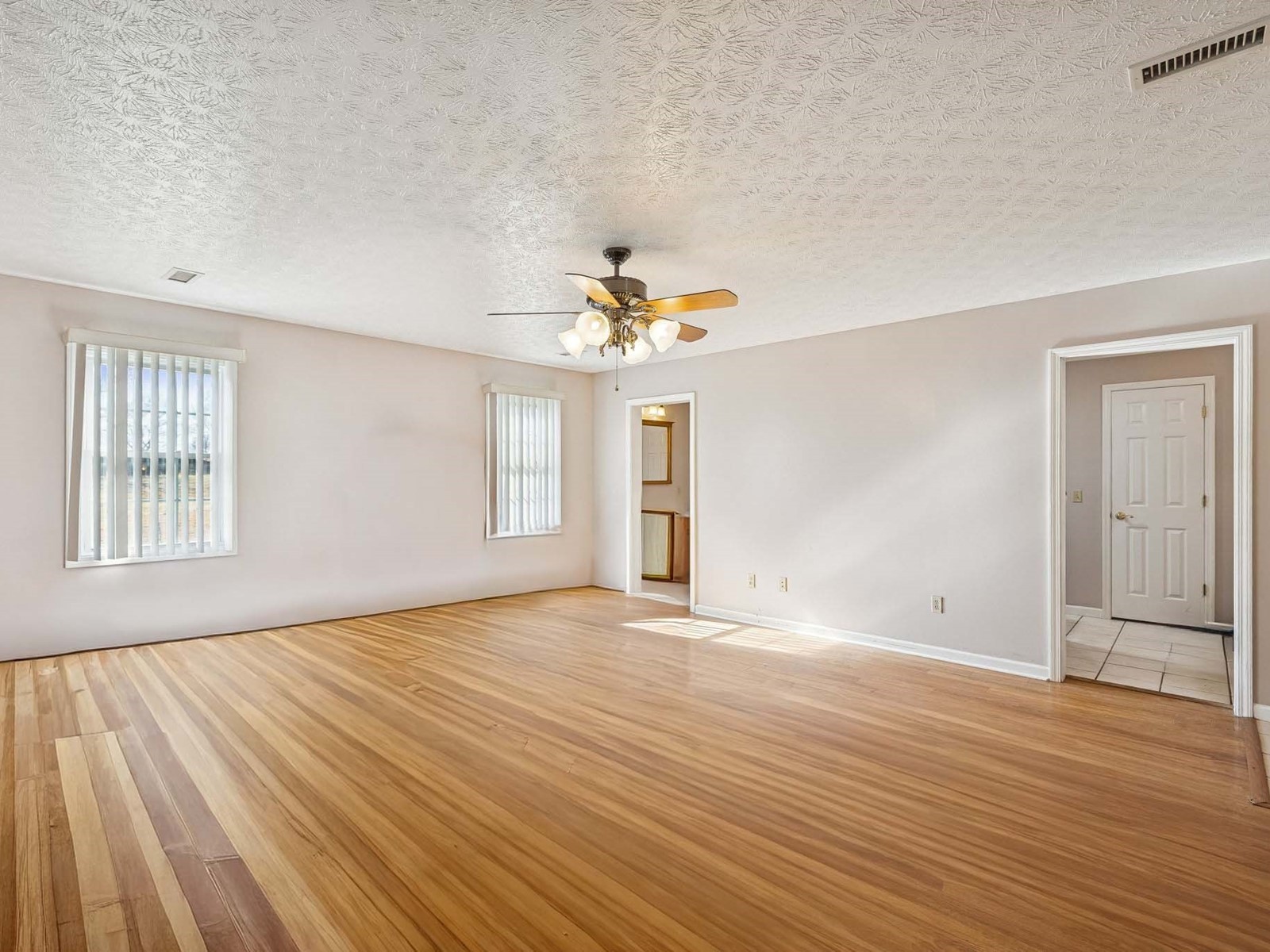 394 Pruett Road Dickson, TN 37055 - Photo 29 of 56 a view of an empty room with wooden floor and a window