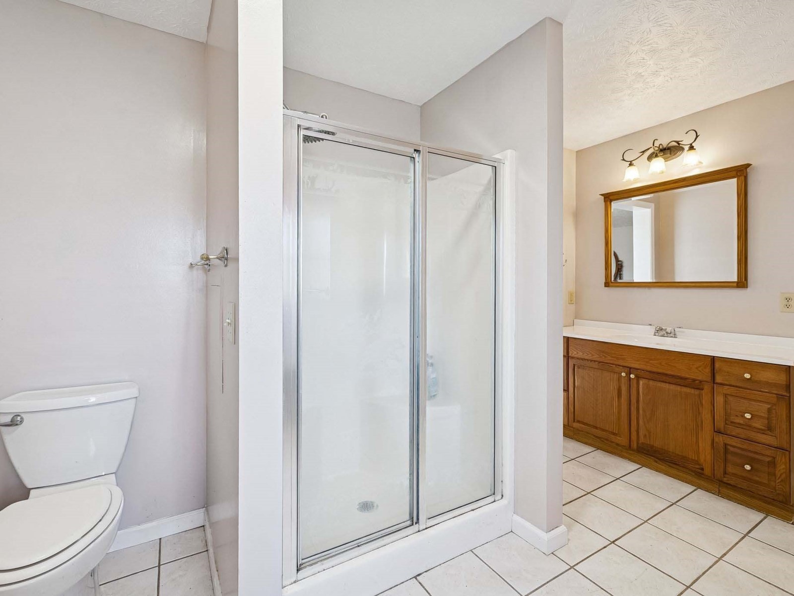 394 Pruett Road Dickson, TN 37055 - Photo 31 of 56 a bathroom with a toilet a sink and shower