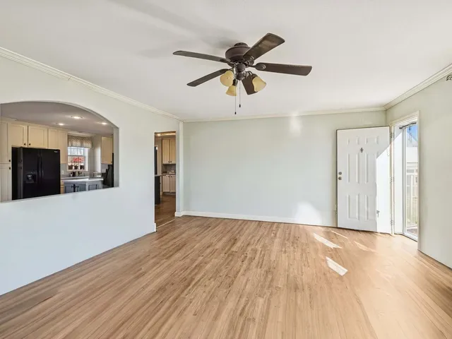 a view of a livingroom with furniture and a potted plant