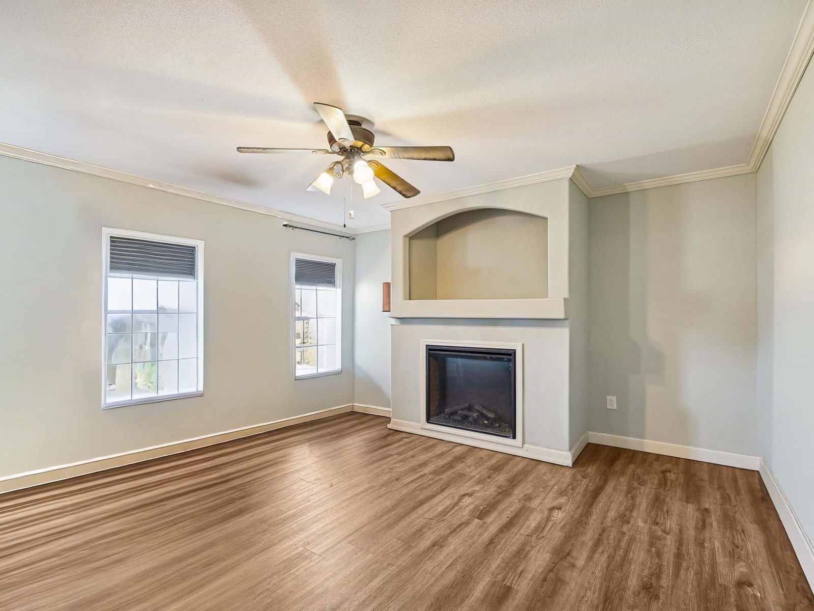 394 Pruett Road Dickson, TN 37055 - Photo 44 of 56 an empty room with wooden floor fireplace and windows