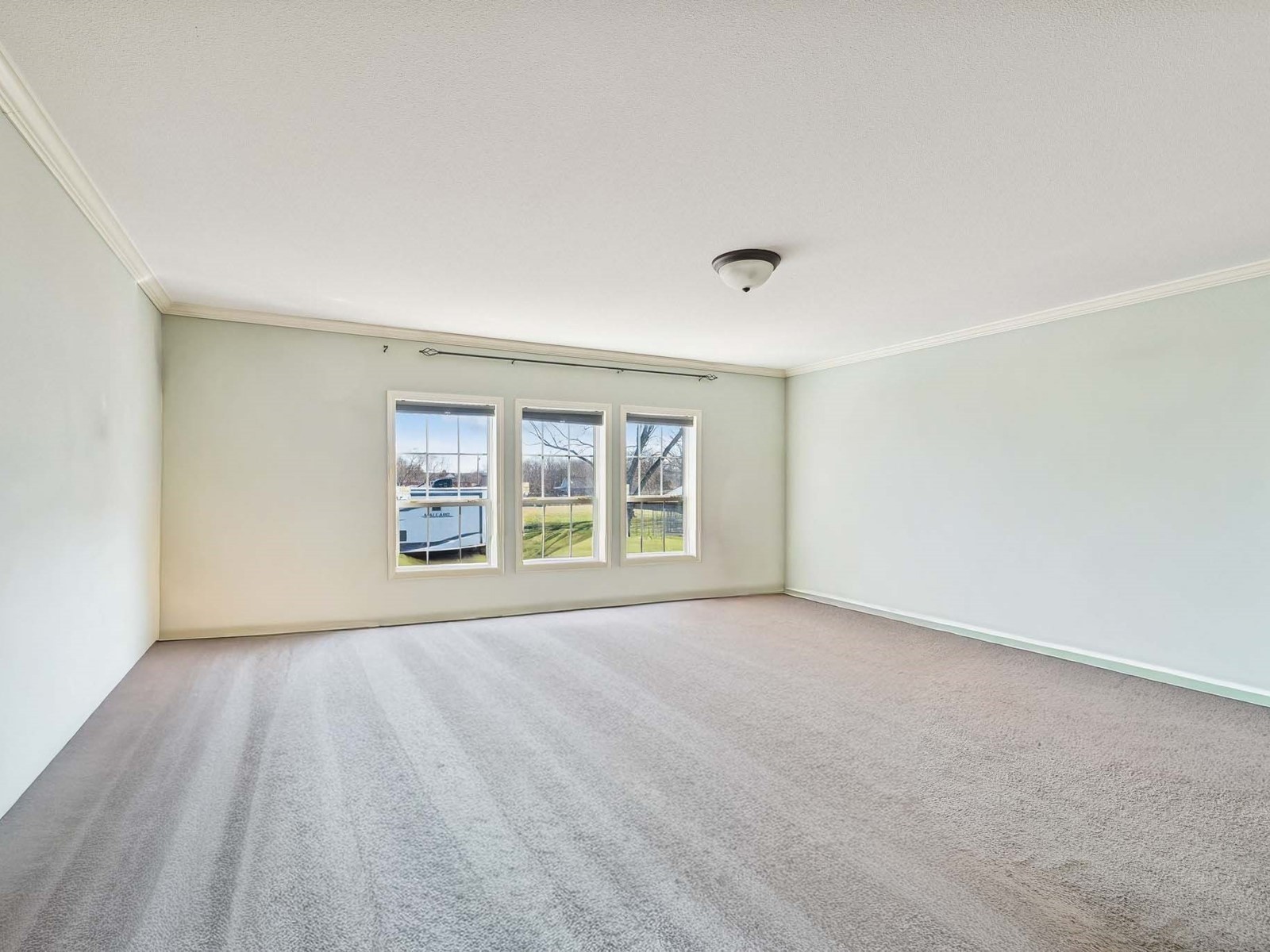 394 Pruett Road Dickson, TN 37055 - Photo 46 of 56 a view of an empty room with a window and wooden floor