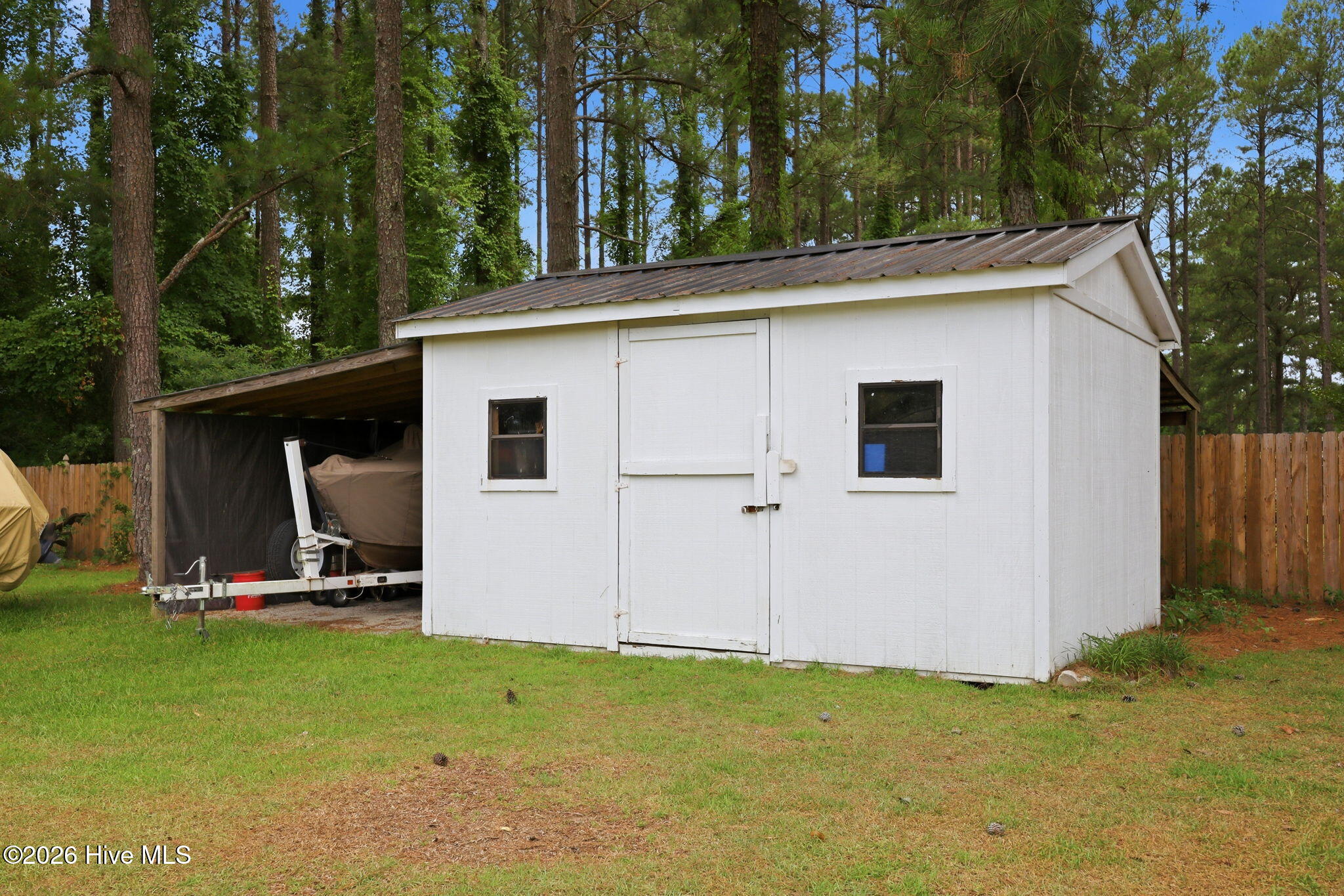 4076 Mobleys Bridge Road Grimesland, NC 27837 - Photo 55 of 66 shed for mowers etc and lean to for any other equipment