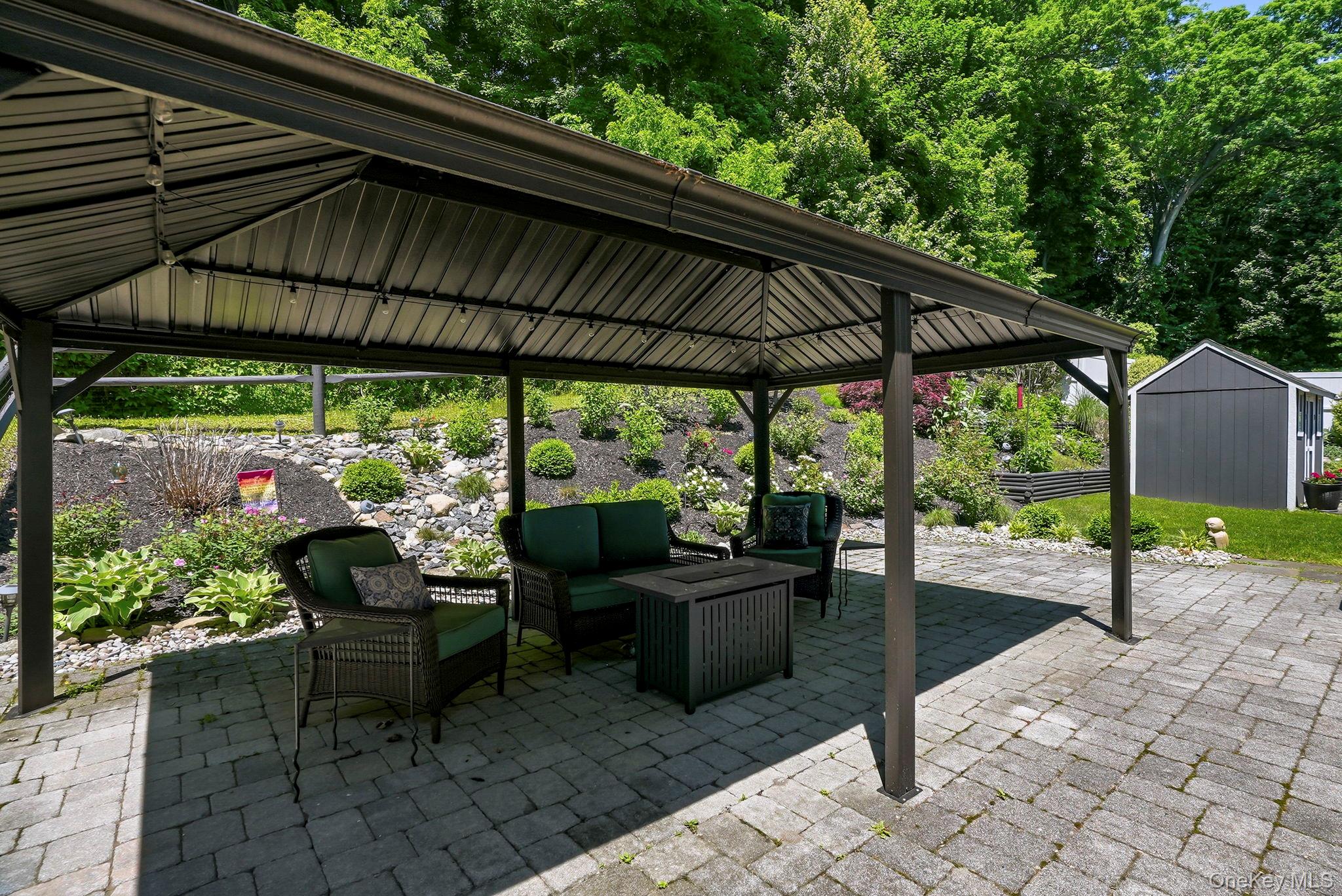 31 Ridge Road Cortlandt Manor, NY 10567 - Photo 36 of 39 Summer sun isn't an issue with the large pergola.