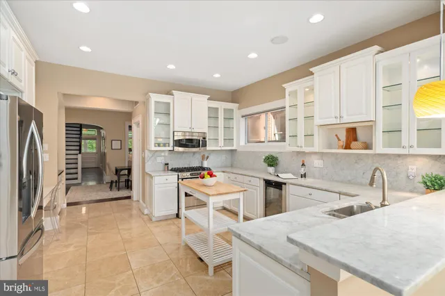 a kitchen with counter top space cabinets and stainless steel appliances