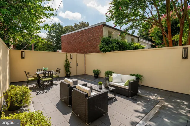 a view of a patio in the backyard