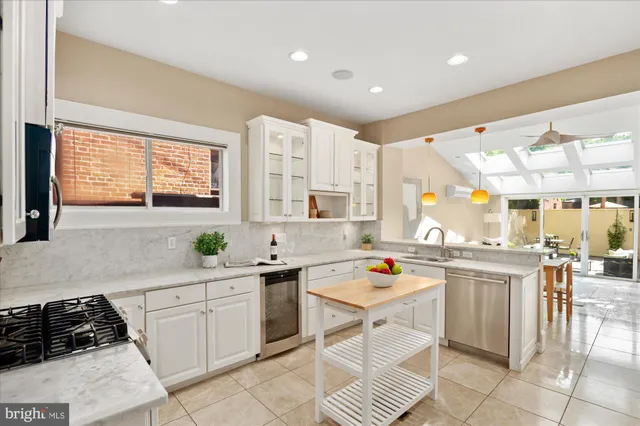a kitchen with a sink and appliances