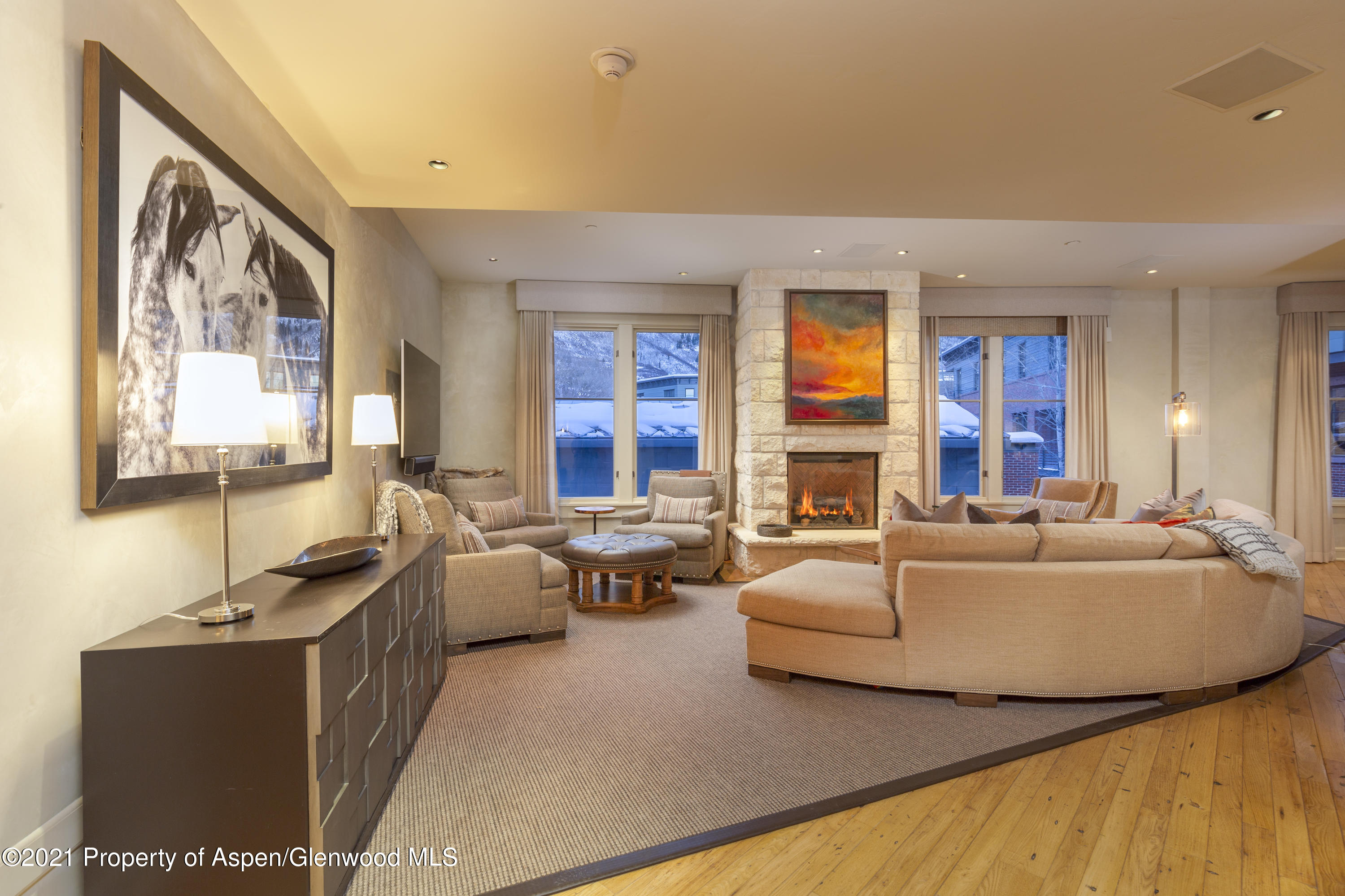 101 Founders Place, Unit 202 Aspen, CO 81611 - Photo 11 of 26 a living room with furniture and a large window