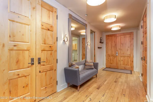 a spacious bathroom with a tub shower and a sink