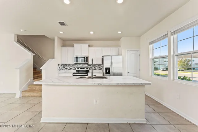 a bathroom with a sink toilet and vanity