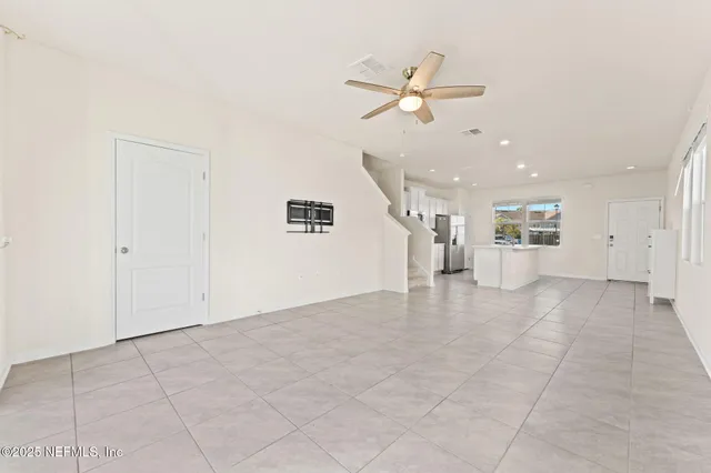 a front view of a building with a garden