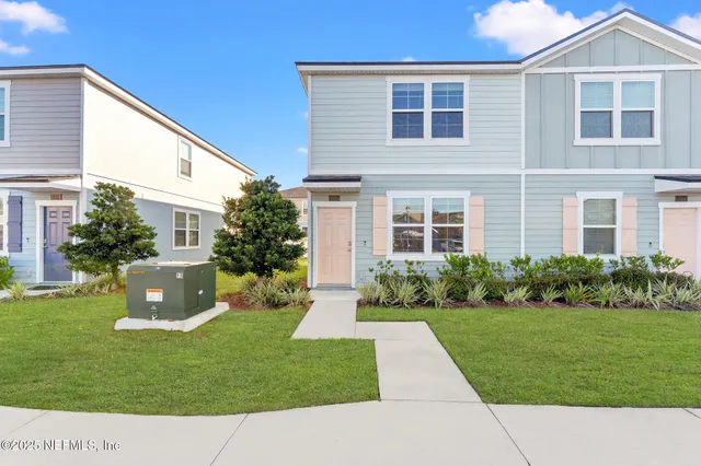 a kitchen with stainless steel appliances a refrigerator sink and cabinets