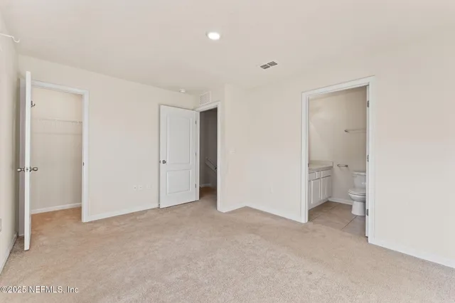 a view of a house with swimming pool and sitting area