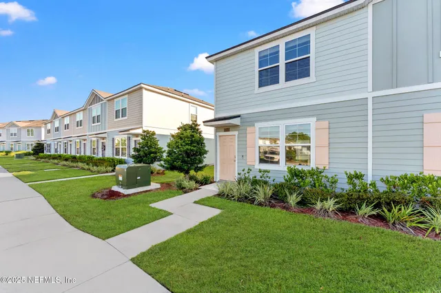 a kitchen with a sink stainless steel appliances and cabinets