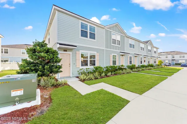 a view of kitchen with stainless steel appliances granite countertop refrigerator sink and cabinets