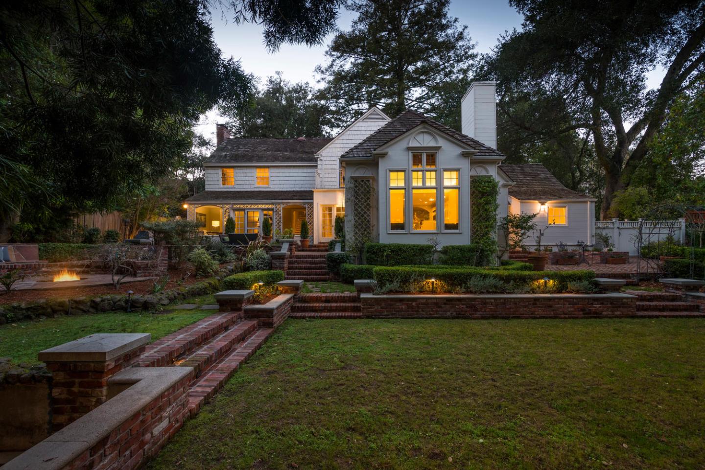 565 Hayne Road Hillsborough, CA 94010 - Photo 31 of 40 a front view of a house with a yard table and chairs