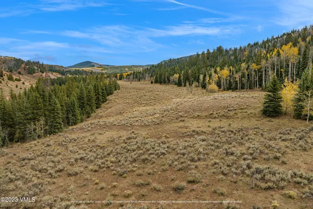 a view of mountain view with mountains in the background