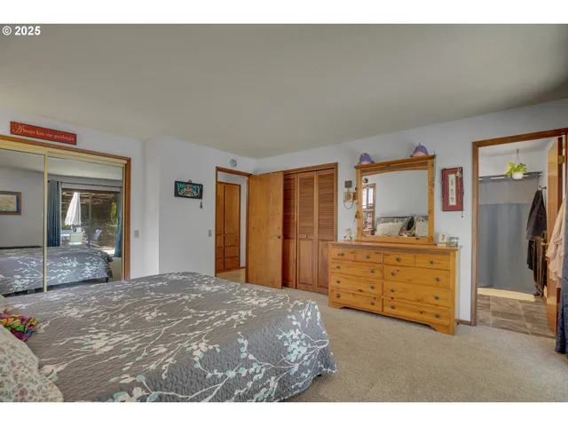a bedroom with a bed and cabinets