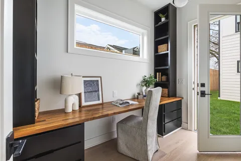 a workspace with furniture and window