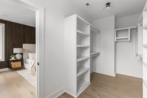 a view of living room filled with furniture and a window